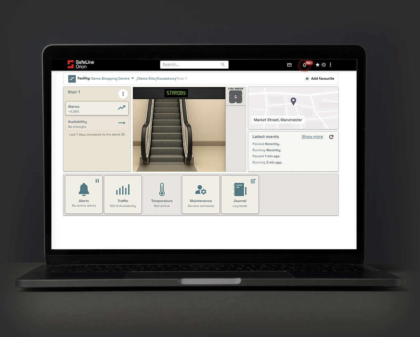 SafeLine Orion dashboard on a laptop showing the live status of a monitored escalator